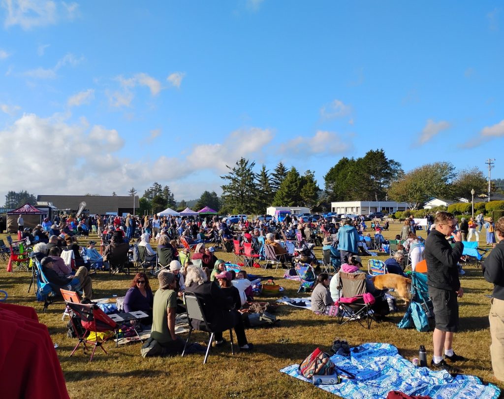 Community members gather with lawn chairs and blankets at Music in the Park in Pierson Park in McKinleyville.