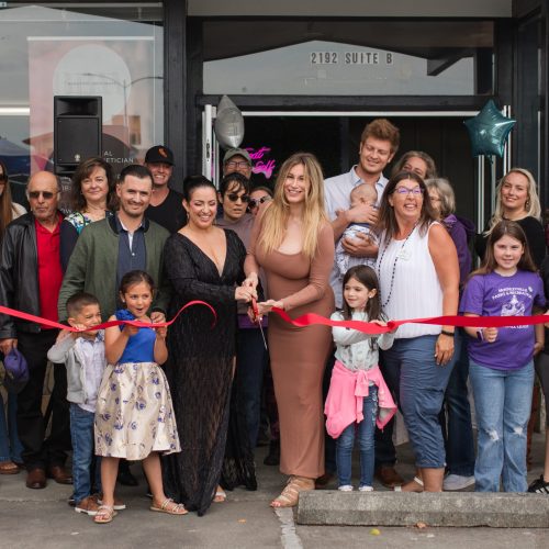 Community members and Chamber representatives celebrating the ribbon cutting for Beautiful Both Ways in McKinleyville.