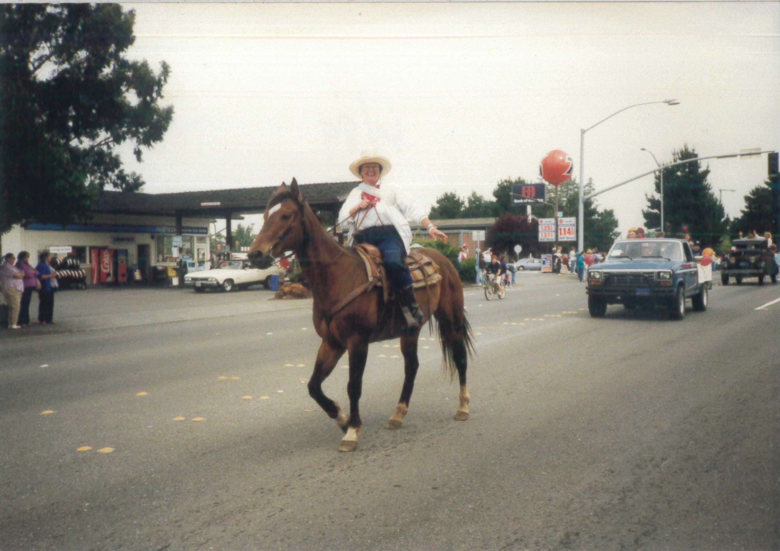 Eleanor Sullivan, 1989 Pony Express Days Grand Marshal, riding horseback down Central Avenue in McKinleyville during the annual parade.