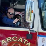 Arcata Fire District Parade Entry – Pony Express Days 2026 An Arcata Fire District firefighter waves from a fire engine during the Pony Express Days 2026 Parade in McKinleyville, California.