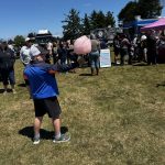 Festival Fun at Pony Express Days 2026 A child holds cotton candy while exploring the Pony Express Days 2026 Festival in Pierson Park in McKinleyville, California.