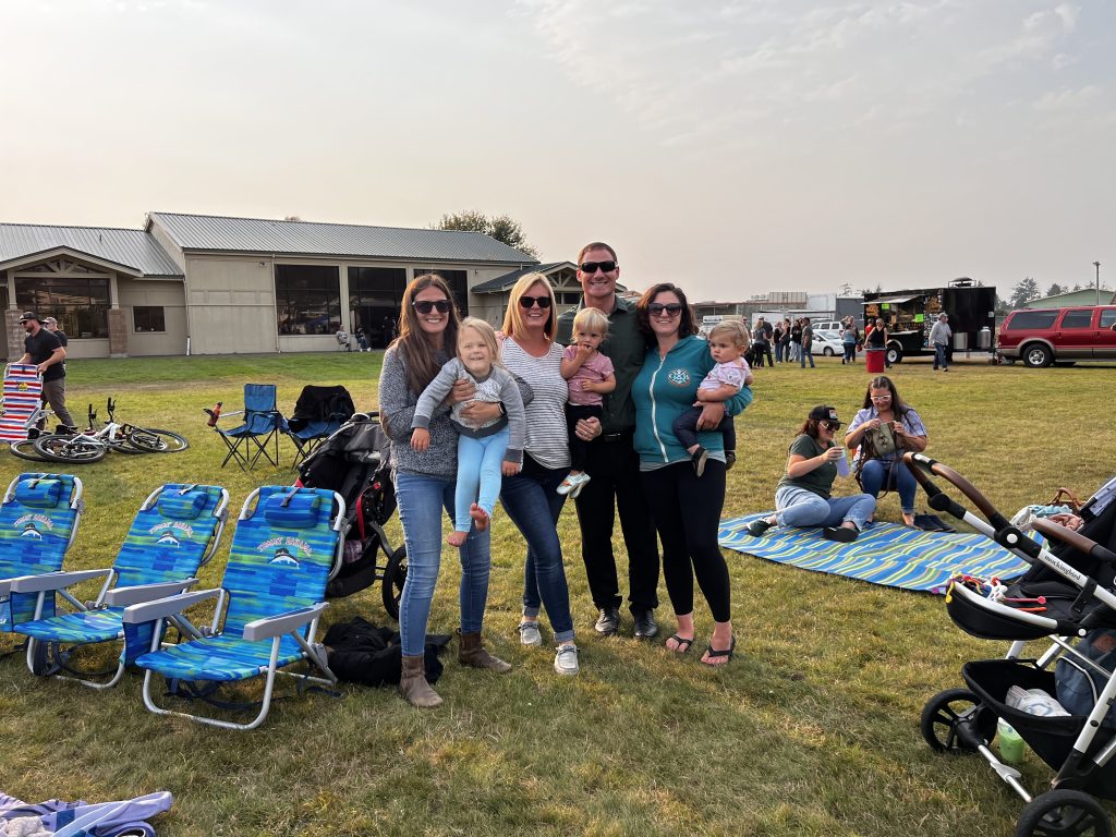 Families gathered on the lawn at a free summer community event in McKinleyville.