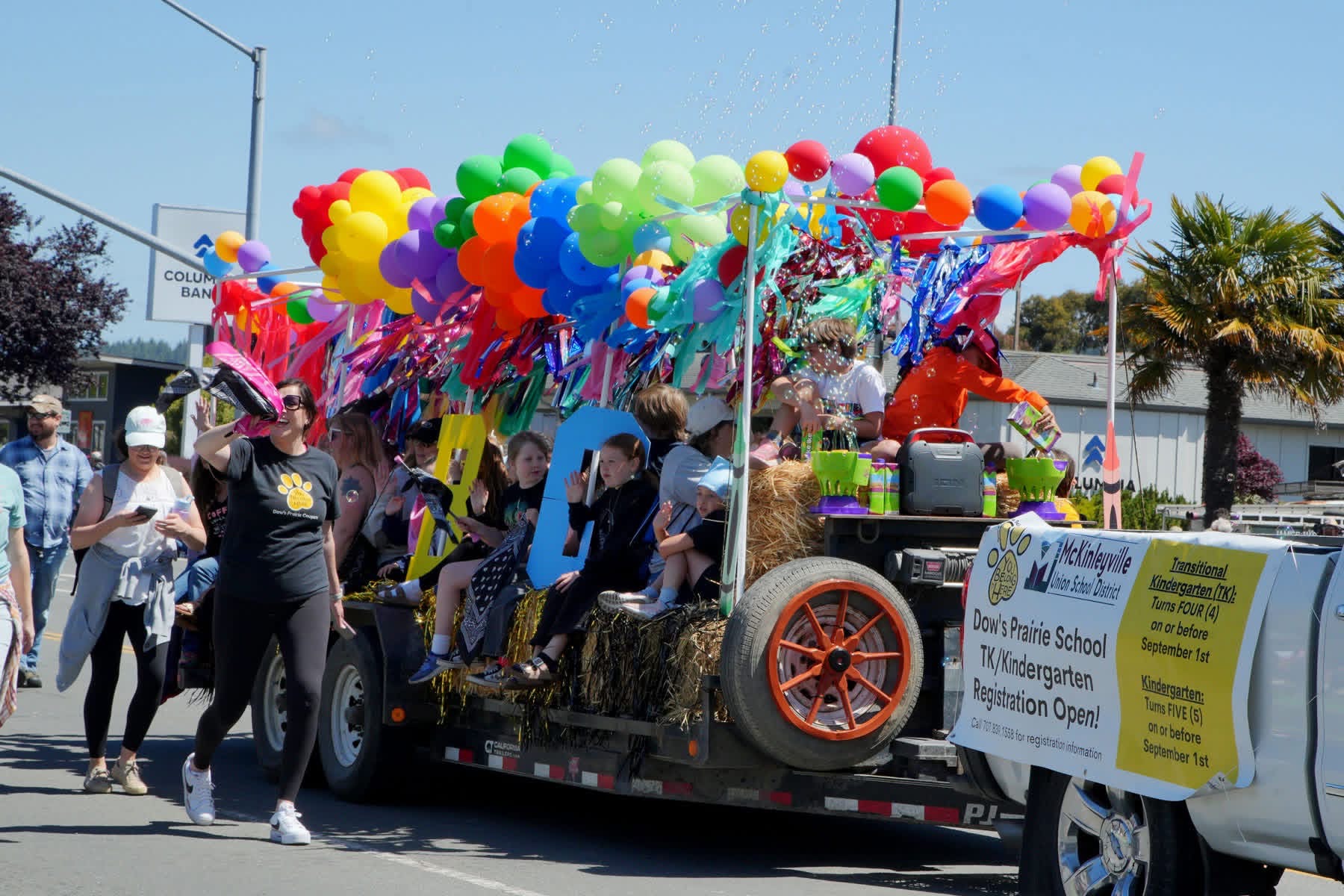 Children riding on a decorated Pony Express Days parade float in McKinleyville.