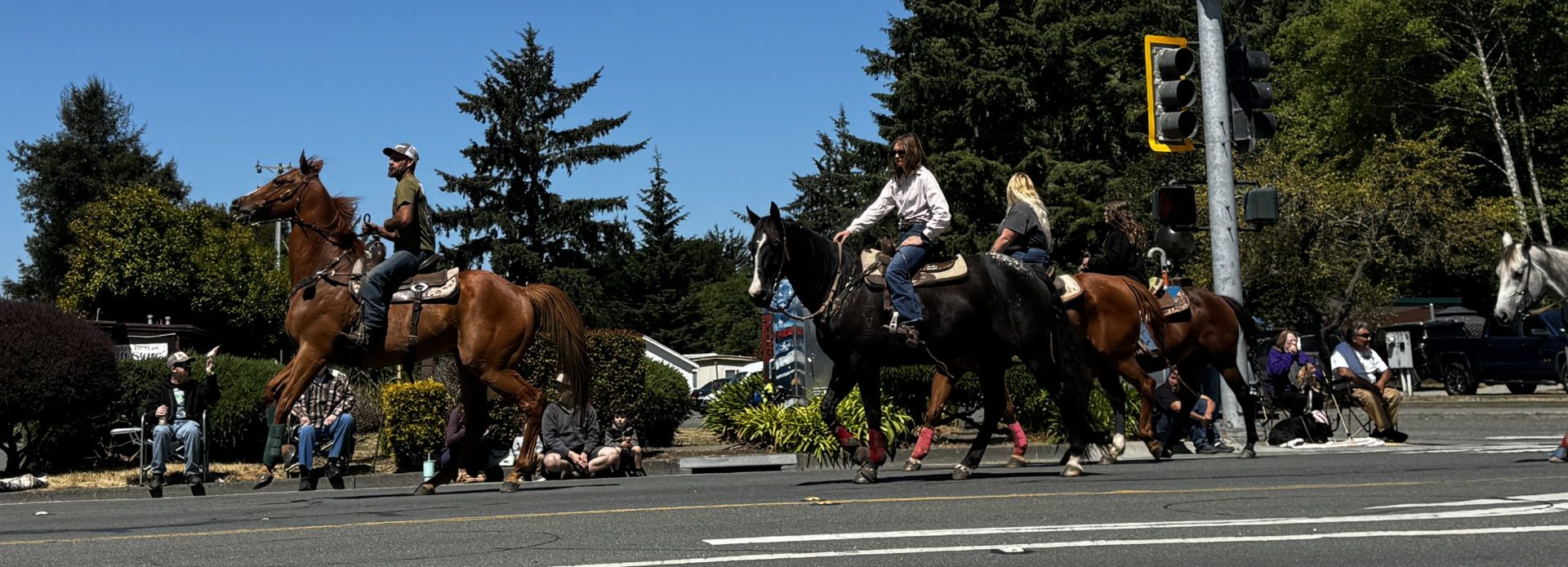 Horseback riders travel down Central Avenue during the Pony Express Days parade in McKinleyville, California.