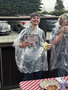 Pony Express Days 2026 Pie Eating Contest Teen Champion Teen Champion winner holds a certificate after the 2026 Pony Express Days Pie Eating Contest at Six Rivers Brewery.