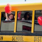 Students Wave from School Bus During Pony Express Days 2026 Parade Students wave pom-poms from a school bus during the Pony Express Days 2026 Parade in McKinleyville, California.
