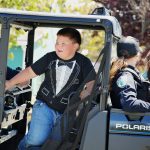 Young Parade Participants Ride with Public Safety Volunteers – Pony Express Days 2026 Young parade participants ride in a utility vehicle alongside a public safety volunteer during the Pony Express Days 2026 Parade in McKinleyville, California.