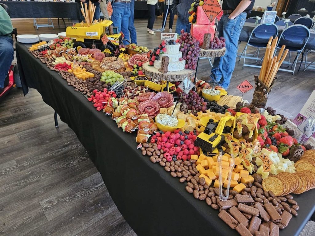Elegant grazing table by Buck Wild Boards featuring artisan cheeses, charcuterie, fresh fruit, crackers, and appetizers for a wedding or special event in McKinleyville.