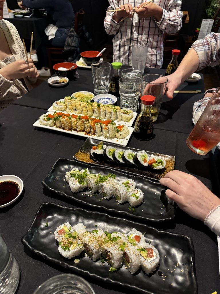 Assorted sushi rolls served family-style on platters at a restaurant in McKinleyville.