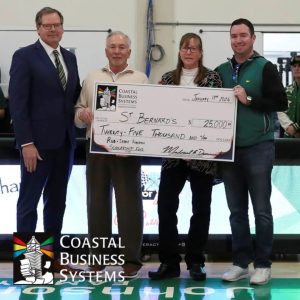 Four people hold a ceremonial $25,000 donation check from Coastal Business Systems made to St. Bernard’s.