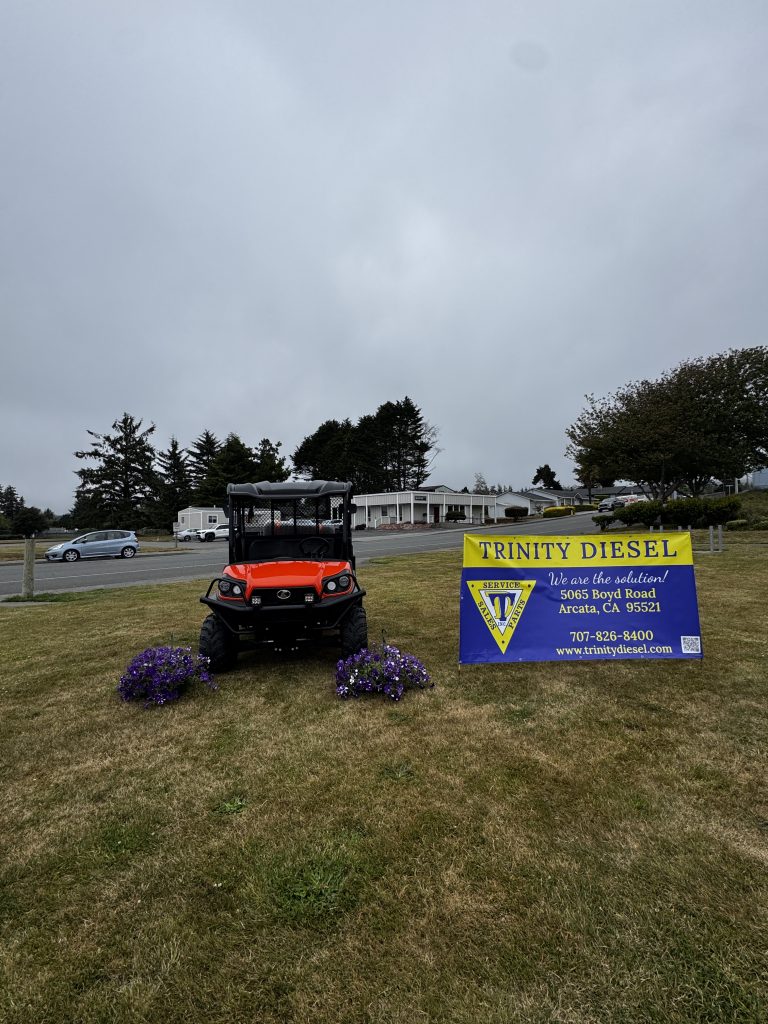 Red utility vehicle and flower baskets supported by the McKinleyville Area Fund grant