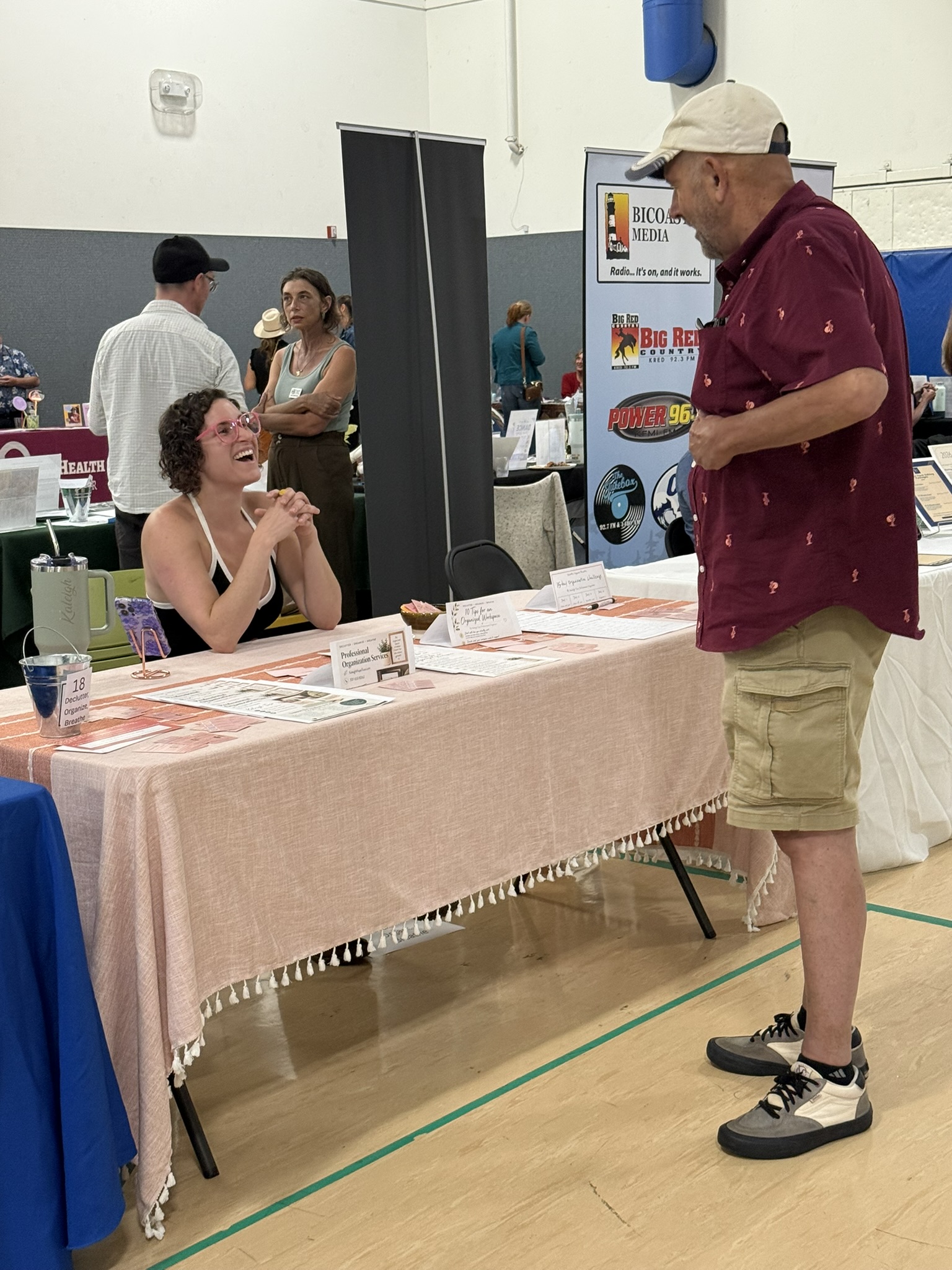 A local business representative connecting with an attendee at the McKinleyville Chamber's 2026 Mega Mixer