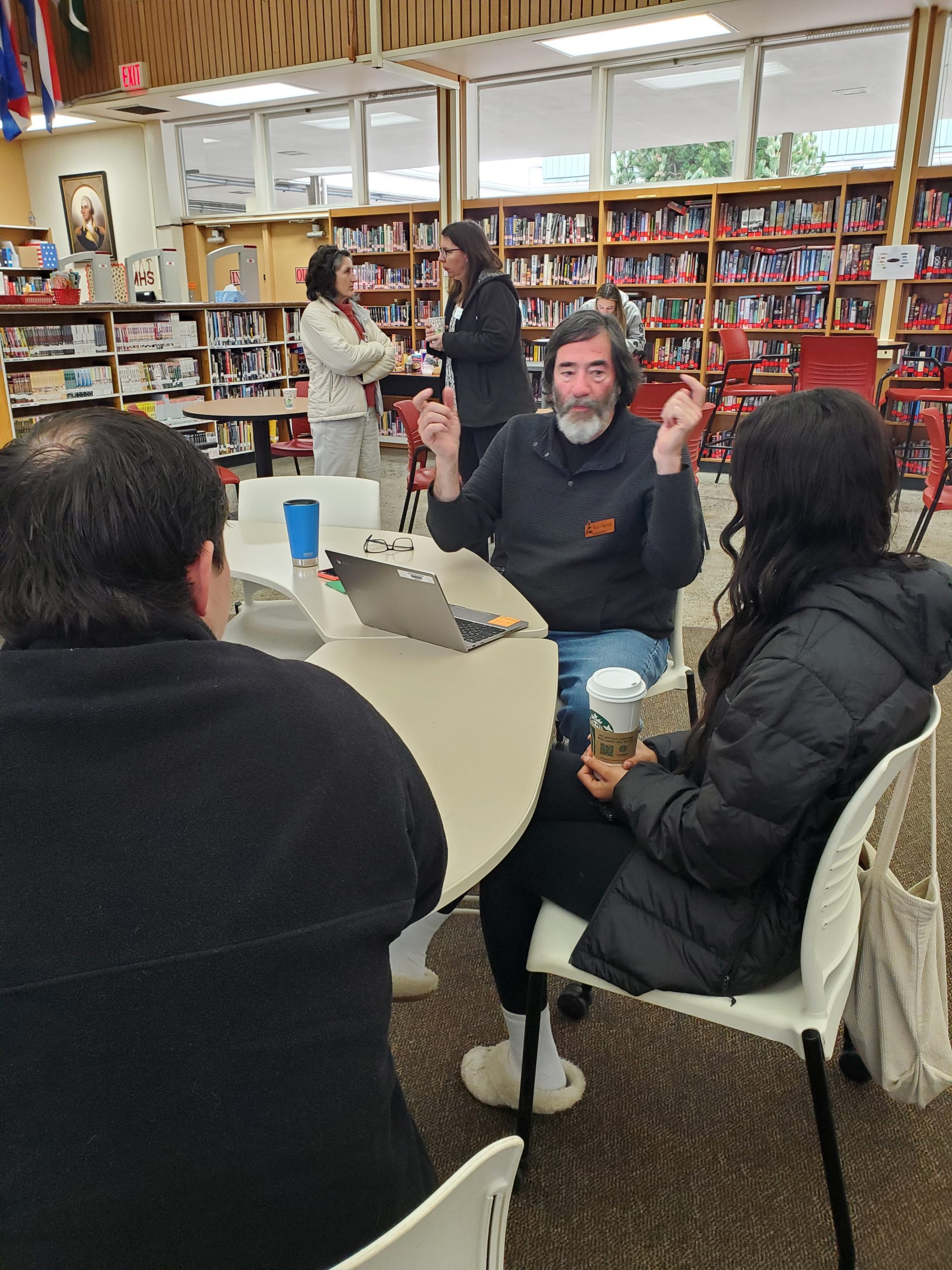 Participants receiving employment guidance at a local resume workshop.