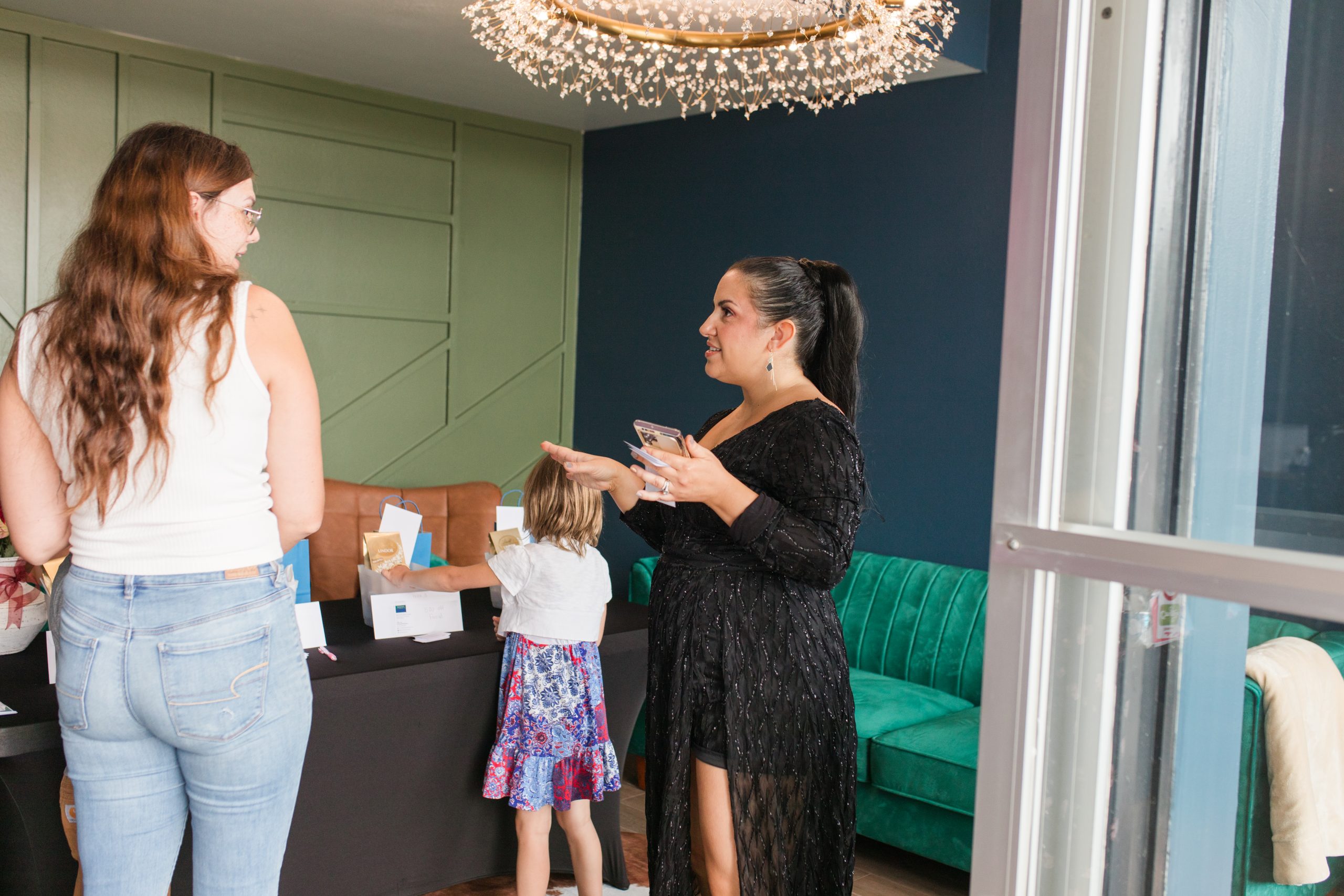 Guests connecting inside a McKinleyville business during a grand opening celebration